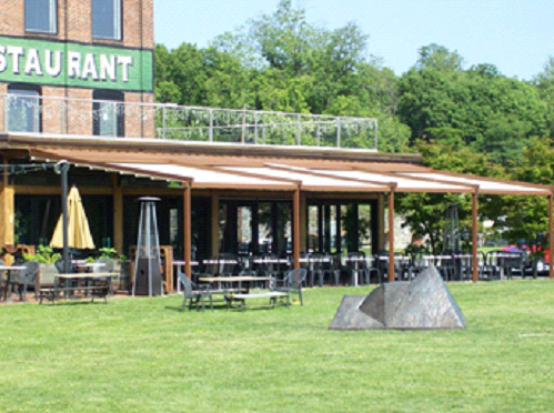 reatuarant sign in green with a view of the pergola completely closed