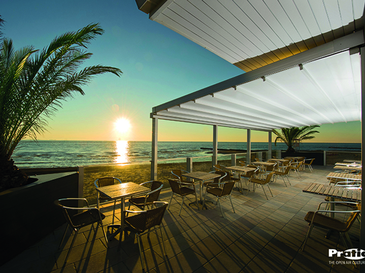 Pergolas for any setting in Maryland pergola over an oceanfront seating area with palm trees sand and a sunset