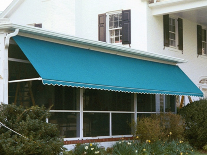 blue awning extended ovr a large group of windows