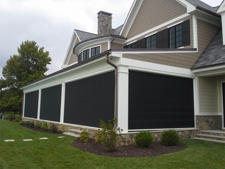 Screened-in porch on white and tan house