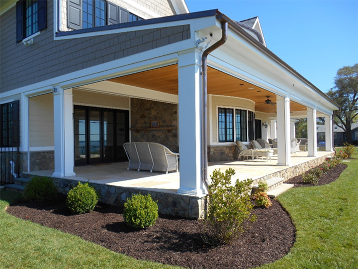 Large front porch with furniture and fans and screens