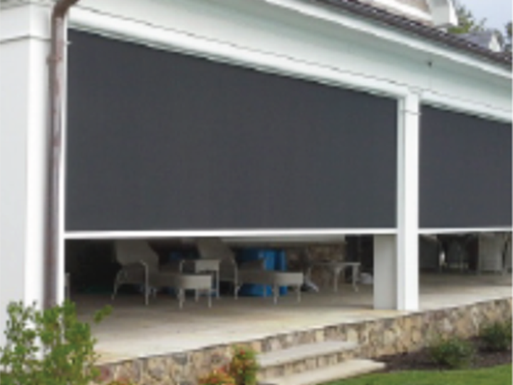 large screens that zipper are being shut on a large white front porch with stone steps